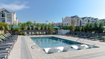Outdoor heated pool with tanning ledge